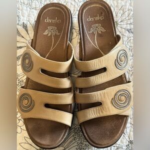 Dansko. Leather sandals with a wedge sole. Excellent condition.